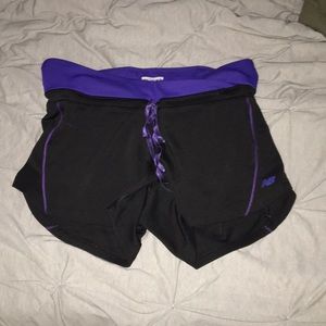 Black & purple New Balance spandex shorts.